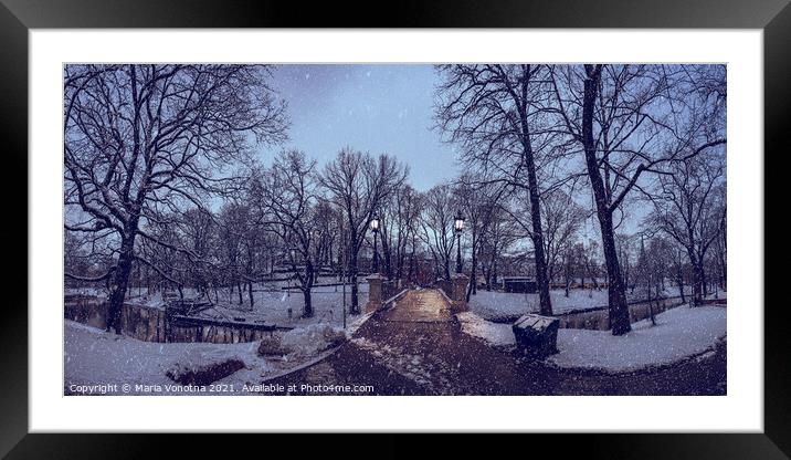 Panorama of a snowy city park during in the evening Framed Mounted Print by Maria Vonotna