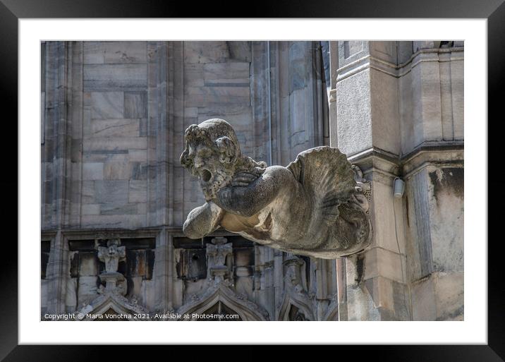 Man gargoyle statue on cathedral Framed Mounted Print by Maria Vonotna