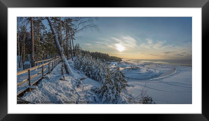 Walk along snowy sea coast path Framed Mounted Print by Maria Vonotna