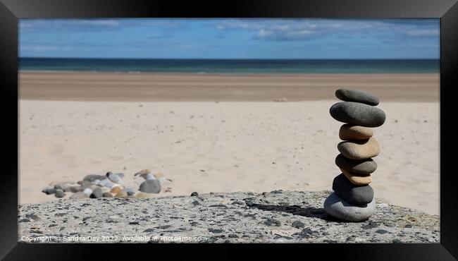 Rocks on the beach Framed Print by Sandra Day