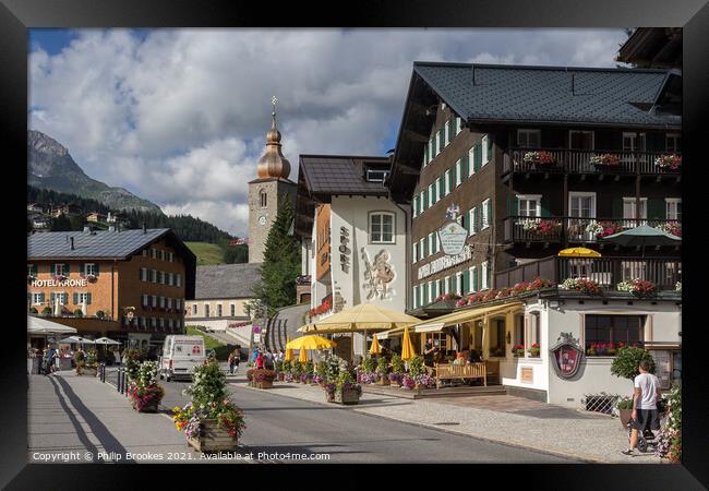 High Street in Lech, Austria Framed Print by Philip Brookes