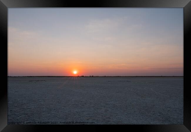 Sun Setting in Makgadikgadi Salt Pan - Empty Flat Plain and Hori Framed Print by Dietmar Rauscher