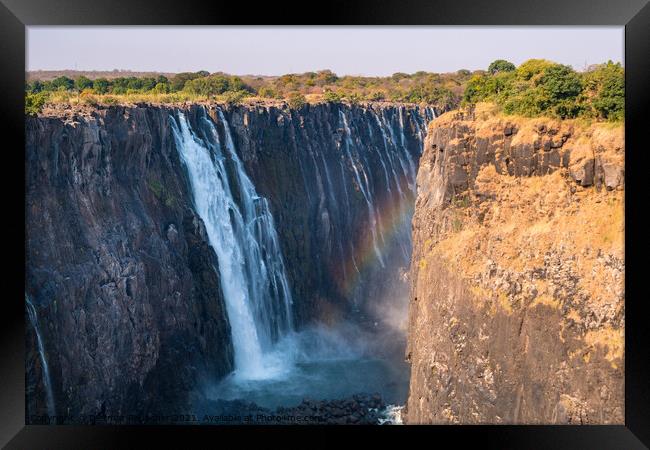 Victoria Falls and Gorge with Rainbow Framed Print by Dietmar Rauscher
