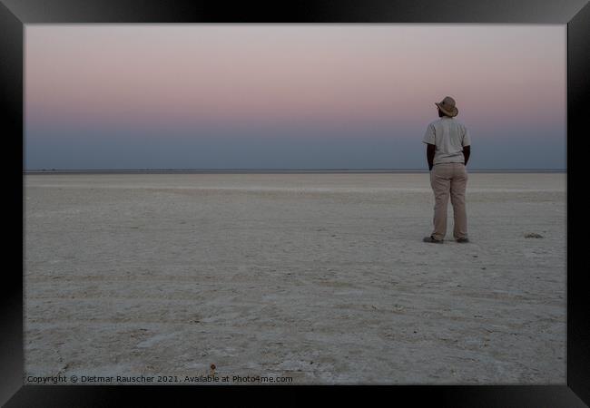 Dusk in Makgadikgadi Salt Pan - Black Man Gazing at Horizon Framed Print by Dietmar Rauscher