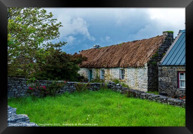 Thatched cottage Framed Print by kenneth Dougherty