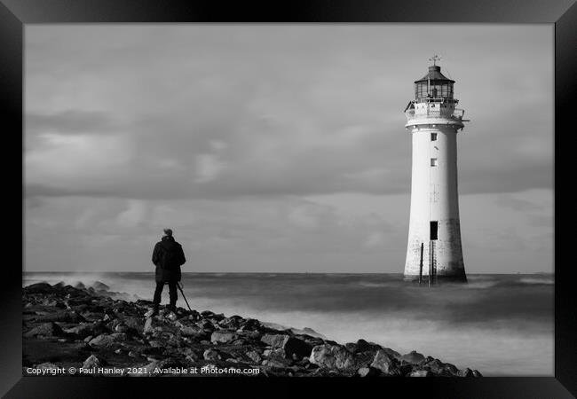 Photographing a lighthouse during a storm Framed Print by Paul Hanley