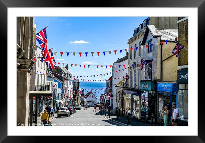 Broad Street Lyme Regis with bunting and union jack flags Framed Mounted Print by Love Lyme Regis