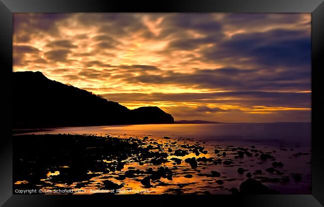 Charmouth Sunrise Framed Print by Les Schofield