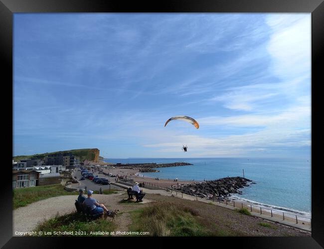 Paragliding over  west Bay Jurassic coast Framed Print by Les Schofield