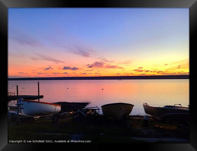 Boats and sunset  Framed Print by Les Schofield