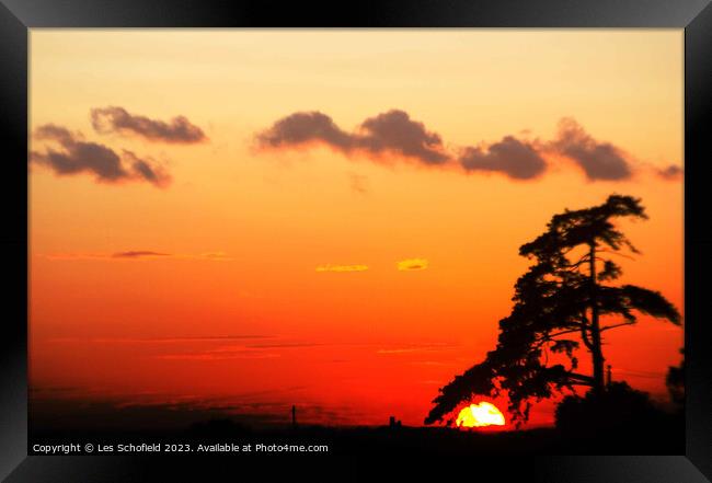 Radiant Sunset Over Majestic Landscape Framed Print by Les Schofield