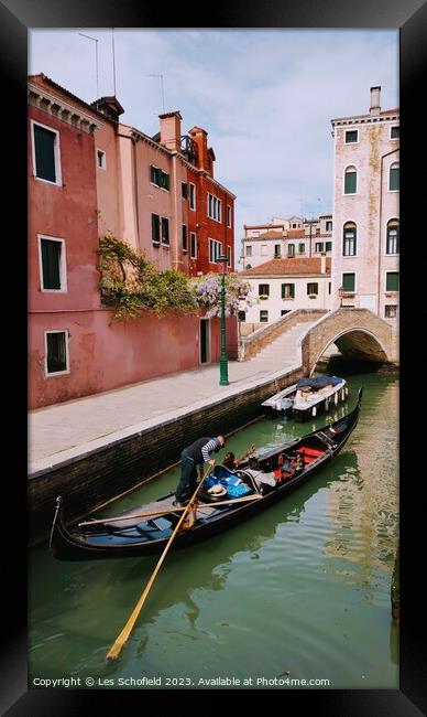 Gondola on the Venice canal  Framed Print by Les Schofield