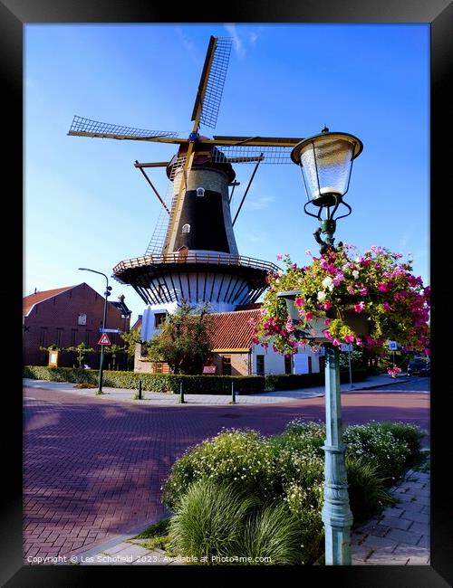 Windmill in wassaner Netherlands  Framed Print by Les Schofield