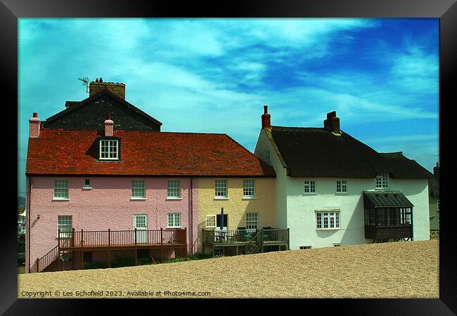West Bay Cottages on the Beach Framed Print by Les Schofield