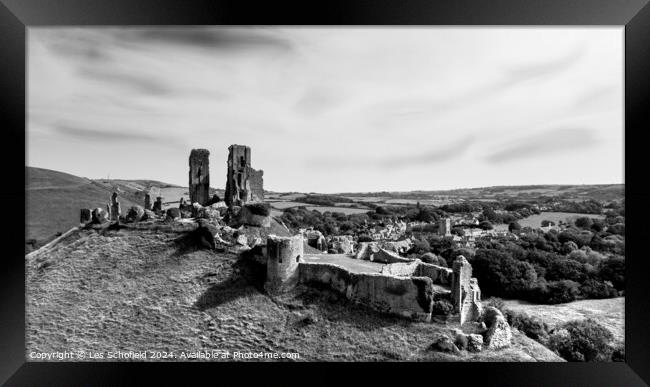 Corfe Castle Ruins Framed Print by Les Schofield