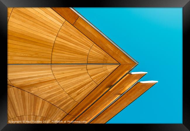 Abstract view of roof structure against blue sky.  Framed Print by Paul Tuckley