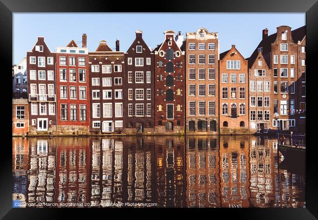 Traditional Dutch buildings at Damrak in Amsterdam Netherlands Framed Print by Marcin Rogozinski