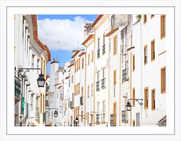White street in Evora. Portugal Framed Mounted Print by Stefano Orazzini