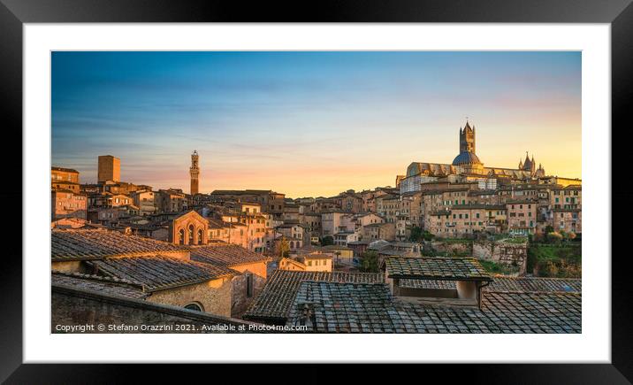 Siena panoramic skyline at sunset. Mangia tower and Duomo Framed Mounted Print by Stefano Orazzini
