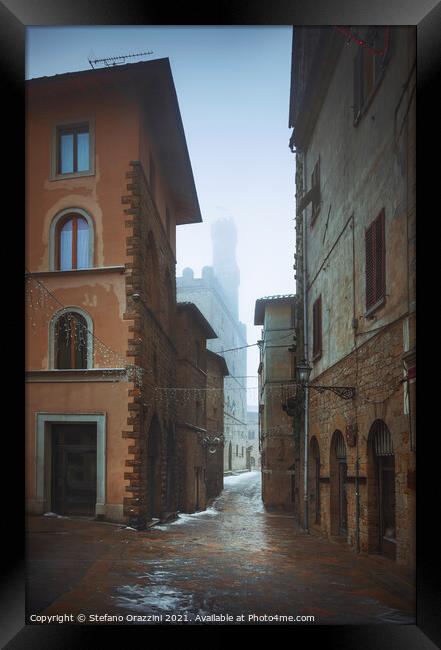 Volterra old town during a snowfall in winter. Tuscany, Italy Framed Print by Stefano Orazzini