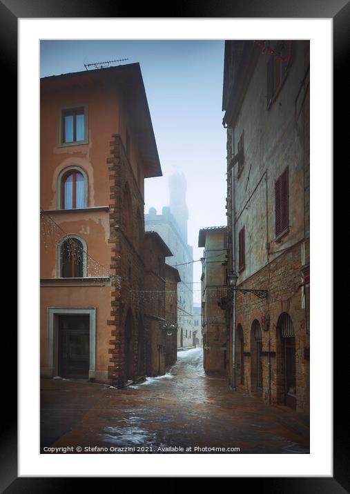 Volterra old town during a snowfall in winter. Tuscany, Italy Framed Mounted Print by Stefano Orazzini