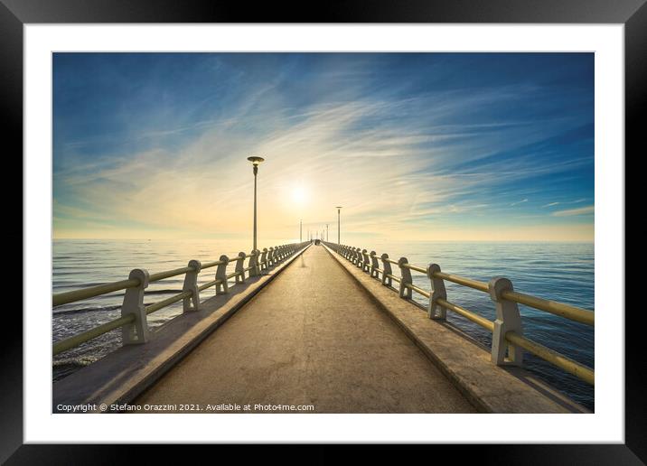Pier and sea in Forte dei Marmi at sunset. Versilia, Tuscany Framed Mounted Print by Stefano Orazzini