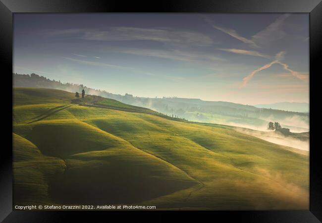 Volterra foggy landscape, trees, rolling hills and green fields  Framed Print by Stefano Orazzini