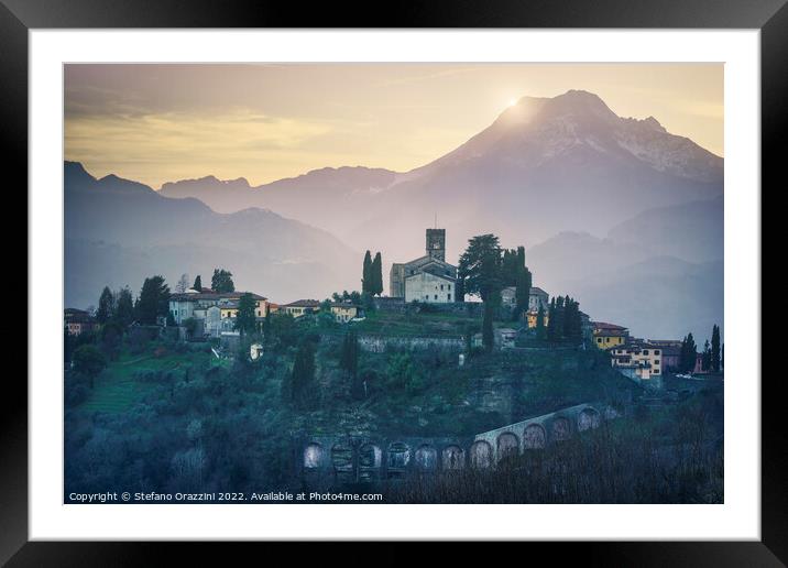 Barga town and Alpi Apuane mountains in winter. Tuscany Framed Mounted Print by Stefano Orazzini