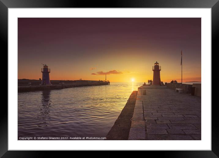 Castiglione della Pescaia, red and blue lighthouses at sunset. Framed Mounted Print by Stefano Orazzini