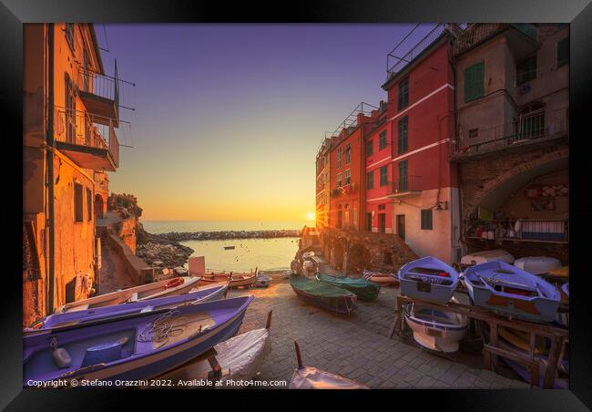 Riomaggiore village boats in the street at sunset. Cinque Terre Framed Print by Stefano Orazzini