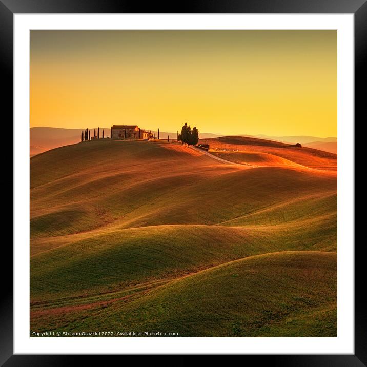 Tuscany, Rolling hills and countryside farm at sunset Framed Mounted Print by Stefano Orazzini