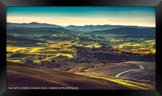 Volterra winter panorama, rolling hills and green fields at sunset Framed Print by Stefano Orazzini