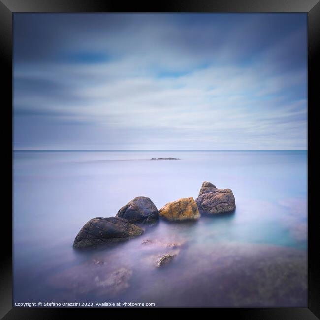 Four Rocks in the Sea. Long exposure photograph Framed Print by Stefano Orazzini