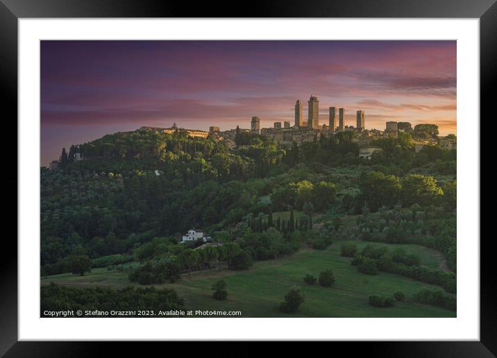 The towers of the village of San Gimignano at sunset. Italy Framed Mounted Print by Stefano Orazzini