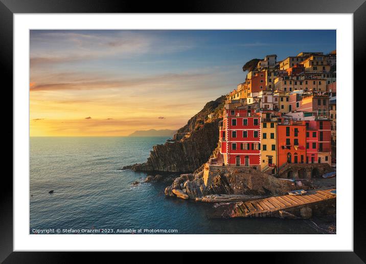 Wonderful sunset over Riomaggiore fishing village. Cinque Terre Framed Mounted Print by Stefano Orazzini