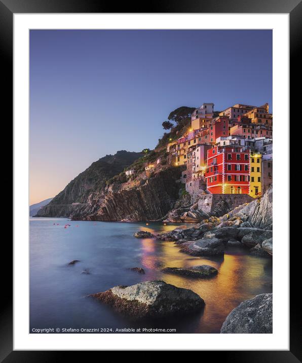 Riomaggiore town, cape and sea at sunset. Cinque Terre, Liguria, Framed Mounted Print by Stefano Orazzini