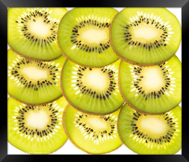 Kiwi fruit slices Framed Print by Keith Bowser