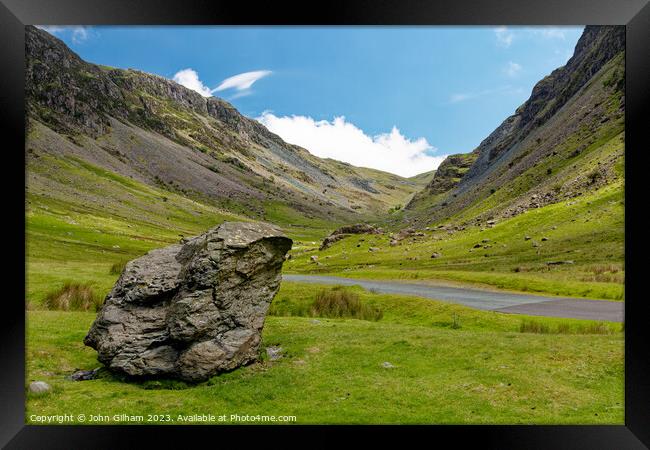 Outdoor mountain with a large rock beside the road in The Lake District Cumbria UK Framed Print by John Gilham