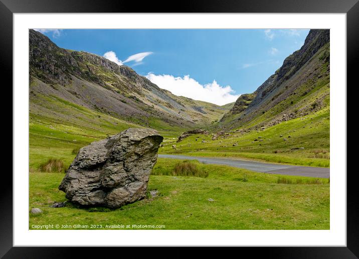 Outdoor mountain with a large rock beside the road in The Lake District Cumbria UK Framed Mounted Print by John Gilham