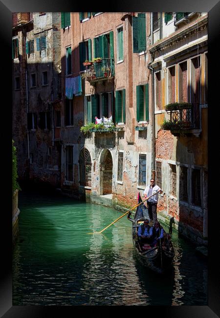 Gondola Ride in Venice Italy Framed Print by John Gilham