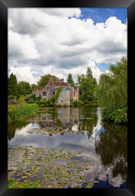 An English ruined Folly castle by the moat in Kent England UK Framed Print by John Gilham