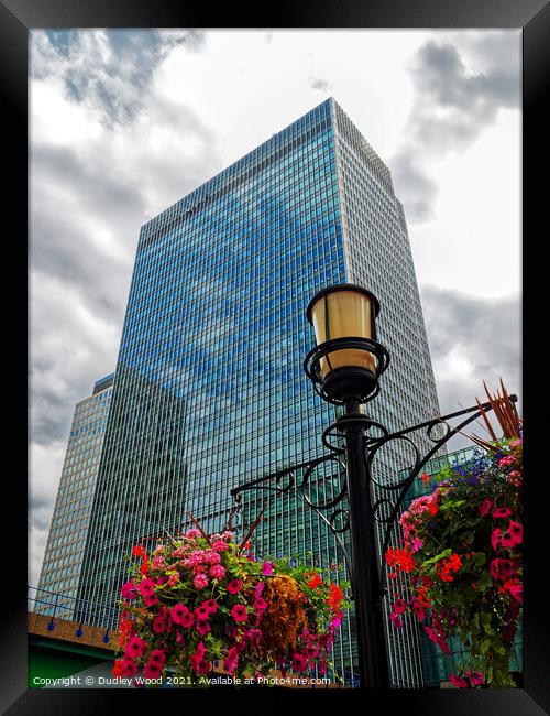 Towering Business Complex Framed Print by Dudley Wood