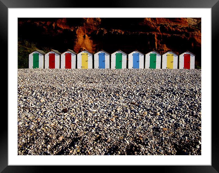 Row of colorful beach huts Framed Mounted Print by nick pautrat