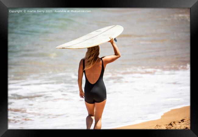Woman Surfer carrying Surfboard Framed Print by martin berry
