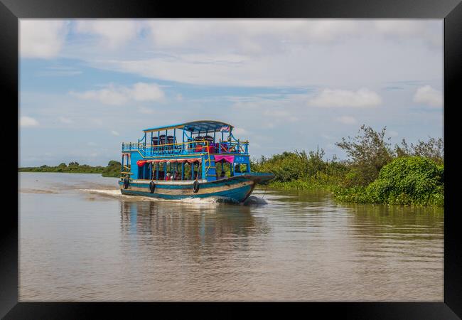 ferry boat at the Tonle Sap Lake in the Siem Reap Province Cambodia Framed Print by Wilfried Strang