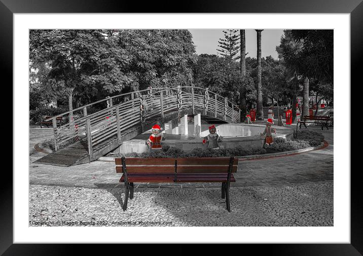 Monochrome (Black and White) Christmas Decorations on a wooden bridge with Red Gingerbread Man.  Framed Mounted Print by Maggie Bajada
