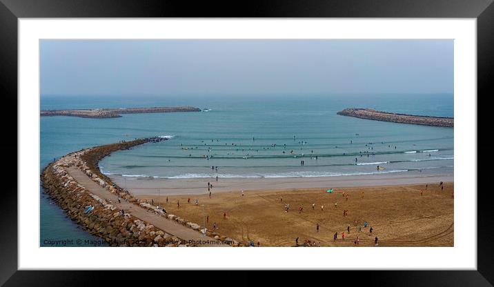 Blue Sea with Red Sand and People Surfing in Rabat Beach, Morocco. Framed Mounted Print by Maggie Bajada