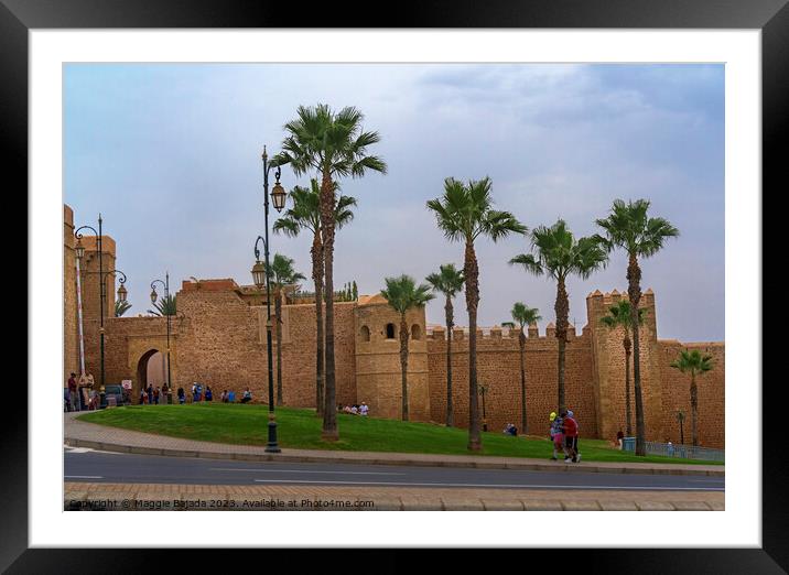 Brown Building with Palm trees of Rabat Citadel in Morocco. Framed Mounted Print by Maggie Bajada