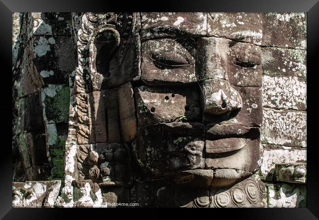 Face in the Stones, Ankor Thom, Cambodia Framed Print by Ian Miller