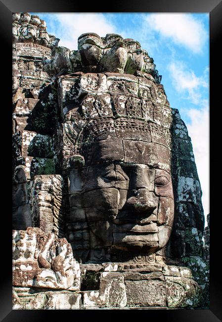 Faces in Stone, Angkor Thom, Cambodia Framed Print by Ian Miller